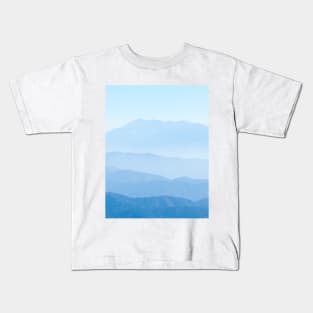 Blue ridge mountain, tiers of mountain ridges stretching into distance under blue sky Kids T-Shirt